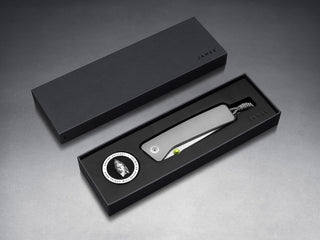 The Barnes integral EDC titanium folding frame lock pocket knife in it's packaging.