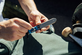 A bit being removed from the storage tray of The Warrick EDC screwdriver.