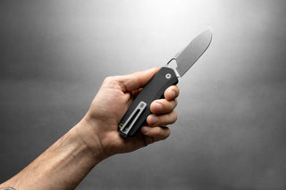 The Folsom Pro EDC pocket knife in a man's hand.