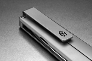 The pocket clip of the Chapter 2 EDC frame lock titanium folding pocket knife.