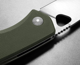 The pivot of The Folsom EDC liner lock folding pocket knife with an OD green handle.