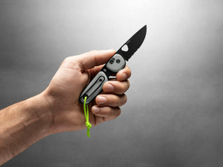 The Redstone primer gray EDC folding slip joint pocket knife in hand.