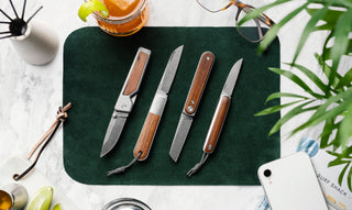 A collection of classic pocket knives with rosewood scales.