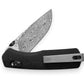 The Carter EDC slide lock folding pocket knife with black micarta handle and a Damascus blade.
