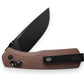 The Carter EDC slide lock folding pocket knife with natural micarta handle and black blade.