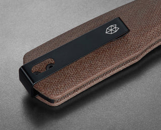 The pocket clip of the Carter EDC slide lock folding pocket knife in Natural micarta.