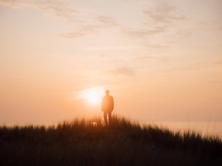 A man enjoying the sunset over the North Sea in Germany.