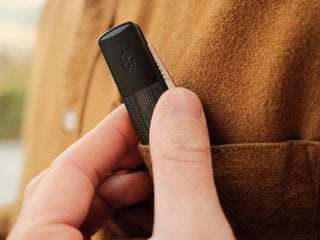The Wayland classic Barlow EDC folding slip joint pocket knife being pulled out of a chest pocket.