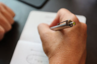 A close up of Burwell EDC click pen top in action