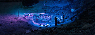 A group of skateboarders hanging out at the Nude Bowl.