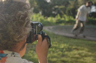 Professional skateboarder and photographer Arto Saari filming a skateboarder.