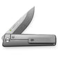 The Chapter 2 EDC titanium pocket knife with a Damasteel blade on the pocket clip side.