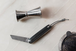 The James x Death & Co Pike classic folding slip joint pocket knife on the bar.