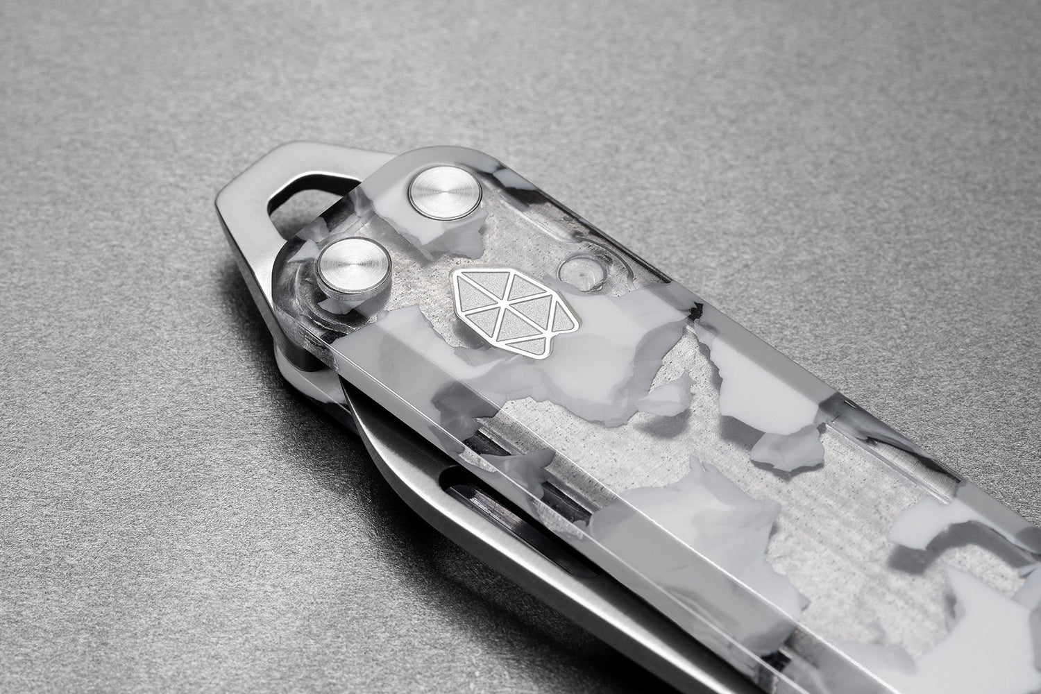 The pry bar of The Elko EDC keychain folding pocket knife with eco acetate scales.