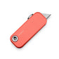 The Palmer utility box cutter knife with coral colored case.