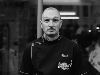 Professional barber Paul Hewitt in his shop.