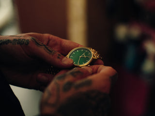 Professional barber Paul Hewitt with his watch in hand.