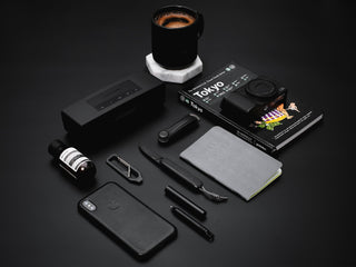 The all black Pike classic gentlemen's slip joint folding pocket knife with other everyday objects.