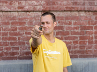 Artist Sebo Walker holding out his collaboration knife.